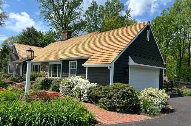 Fresh cedar shake roof on a Cape Cod style home